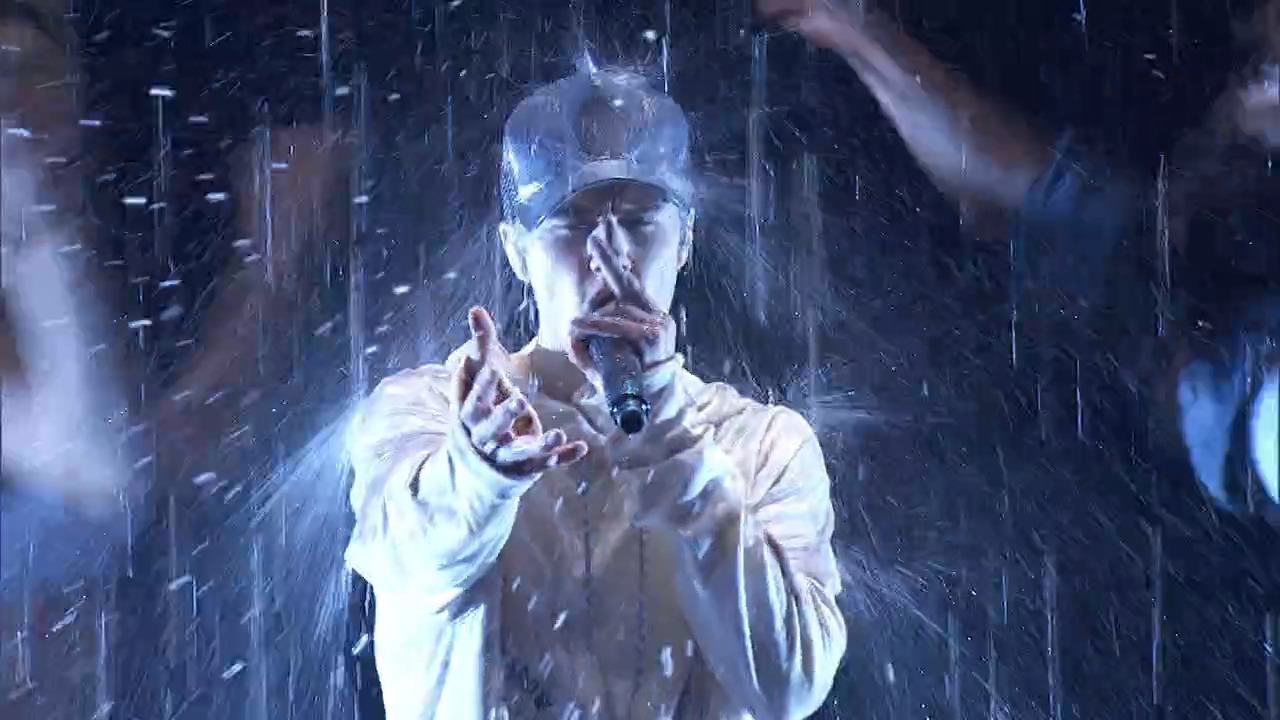Justin Bieber performing in the rain