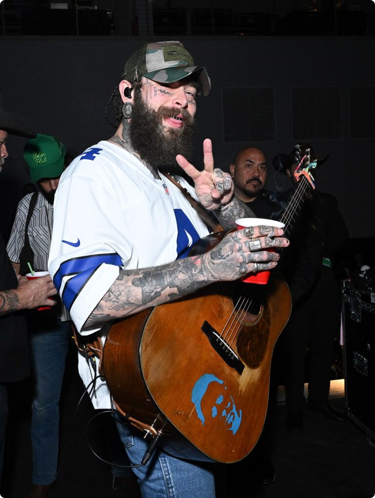 Post Malone posing doing the peace sign